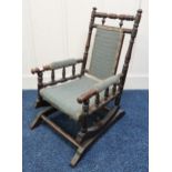 A 20th century oak framed children's American style rocking chair Condition Report:Available upon