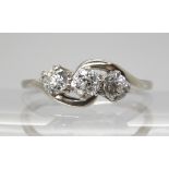 A white metal three stone old cut diamond ring, set with estimated approx 0.65cts in total. Finger