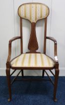 An Edwardian mahogany high back armchair on stretchered cabriole supports, 108cm high Condition