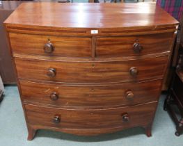 A Victorian mahogany bowfront two over three chest of drawers with turned handles, 105cm high x