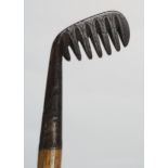 A BROWNS PATENT MAJOR RAKE IRON by Winton of Montrose,foliate decorated head, hickory shaft, 98cm