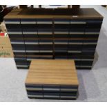 Seven vintage tape cassette storage cases, each with six drawers containing a quantity of