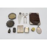 A collection of silver including a silver mounted crocodile leather wallet, by Charles Penny