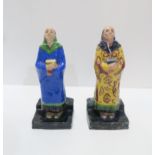 A pair of glazed pottery figures of monks, signed Wm Hogg 36 VI B. Condition Report:Available upon