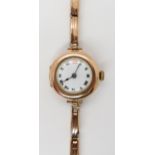 A 9ct gold ladies vintage watch with yellow metal strap, case London import marks for 1918, weight