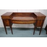 A Victorian mahogany sideboard with single long drawer flanked by bottle drawers on reeded square