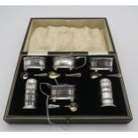 A cased silver condiment set, comprising two preserve pots, two open salts, two casters and four