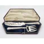 A cased Victorian silver collared fish servers in the kings pattern, with reticulated EPNS