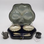 A cased set of silver scallop shell butter dishes and knives, by James Deakin & Sons, Sheffield