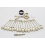 A collection of silver including 16 silver coffee spoons with engraved terminals, 7 by Deakin &