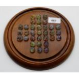 A solitaire game board with a complete set of marbles Condition Report:Available upon request