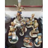 A group of Hummel figures and a table lamp Condition Report:Not available for this lot.