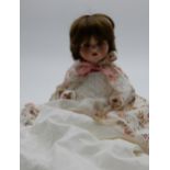 A porcelain child's doll with maker's mark Armand Marseille Germany 990 A 3/0 M Condition Report: