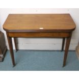 A Victorian mahogany fold over tea table on square tapering supports Condition Report:Available upon