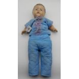 A hard plastic doll with blue eyes Condition Report:Available upon request