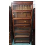 A 20th century mahogany six tier sectional bookcase, 218cm high x 87cm wide x 31cm deep Condition