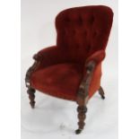 A Victorian button back armchair with turned front supports Condition Report:Available upon request