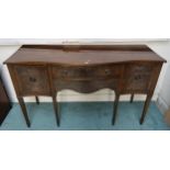 An early 20th century mahogany serpentine front sideboard with two central drawers flanked by