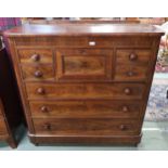 A Victorian mahogany scotch chest with four asymmetrical drawers above three long drawers on