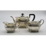 A silver Bachelors three piece tea service, of faceted form, on four bun feet, by Atkins Brothers,