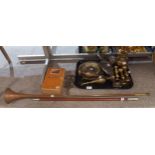 A brass faith, hope and charity trivet dated 1886, a copper hunting horn, a swagger stick,