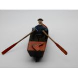 A tin clockwork rowboat and oarsman by E.R. Ives circa 1869 Condition Report:Available upon request