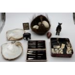 A tray lot comprising an armadillo basket, spelter wild boar novelty thermometer, ostrich eggs,