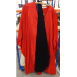 A red university gown, black tail coat and other items Condition Report:Not available for this lot.
