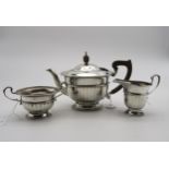 A George V silver Bachelors tea service, of faceted form, with gadrooned rims, the teapot with
