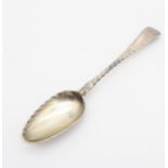 A George III silver Old English pattern picture back tea spoon, the reverse of the bowl embossed