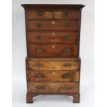 A VICTORIAN MAHOGANY CHEST ON CHEST with corniced top above two short over three long drawers