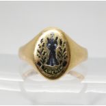 AN ENAMELLED MOURNING RING enamelled with an image of St. Andrew, thistles and a banner reading