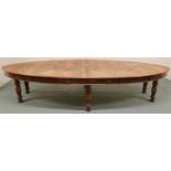 A LATE VICTORIAN OAK OVAL LIBARARY TABLE with moulded oval top with six drawers