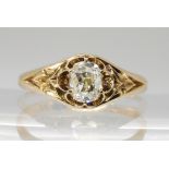A VINTAGE DIAMOND SOLITAIRE set with a cushion cut old cut diamond, with an estimated approx carat