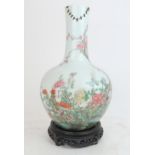 A CHINESE FAMILLE ROSE BALUSTER VASE painted with dragon and butterflies