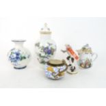 A MEISSEN CHOCOLATE POT with painted decoration of figures, the lid with applied rose, a Bing and