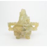 A CHINESE GREEN QUARTZ INCENSE BURNER carved with grotesque handles, kylin finial and on mask and