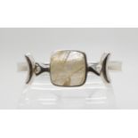 A SILVER GEORG JENSEN BANGLE designed in the 1960's, by Vivianna Torun Bulow Hube for Georg