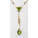 A 15CT GOLD PERIDOT AND PEARL PENDANT & EARRINGS the two peridots in the pendant are a good deep