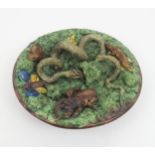 A MAFRA CALDAS PALISSY STYLE MAJOLICA CHARGER the textured ground decorated with snakes, stag