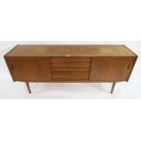 A MID 20TH CENTURY SWEDISH TEAK NILS JONSSON FOR TROEDS "TRIO" SIDEBOARD with central bank of