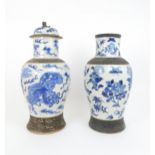 TWO CHINESE BLUE AND WHITE CRACKLEWARE ARCHAIC STYLE VASES one painted with buddhistic lions and