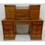 A VICTORIAN OAK TWIN PEDESTAL WRITING DESK with fitted superstructure