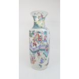 A LARGE CHINESE FAMILLE ROSE VASE painted with mandarin and courtiers amongst pavilions, 62.5cm high