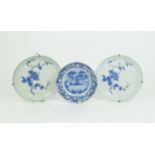 TWO CHINESE BLUE AND IRON RED DISHES each painted with flowers and fruiting branches, character