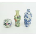 A CHINESE FAMILLE JAUNE BALUSTER VASE painted with a bird amongst foliage, 19cm high, jar with