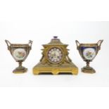 A RICHARD AND CO FRENCH MANTLE CLOCK the ormolu case with lion head handles, swags of laurel, and
