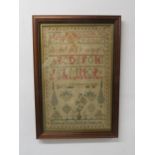 A VICTORIAN SAMPLER 1842 woven in coloured silks by Elizabeth Brown, with vases of flowers, trees,