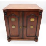 A LATE VICTORIAN OAK SMOKERS CABINET IN THE FORM OF A TWO DOOR SAFE, with ebonised beaded doors