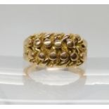 AN 18CT GOLD CLASSIC KNOT RING hallmarked Birmingham 1910. Finger size M1/2, weight 10.2gms